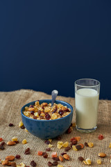 Picture of muesli bowl with glass of milk. Healthy snack or breakfast in the morning.
