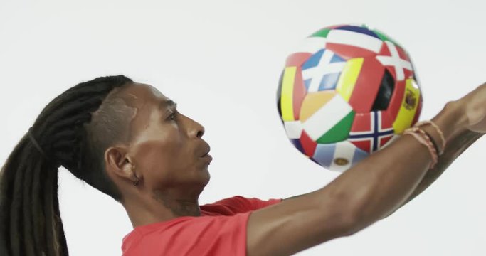 Colombian guy playing with a soccer ball.