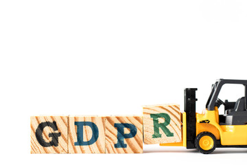 Toy forklift hold letter block r to complete word GDPR (General Data Protection Regulation) on white background