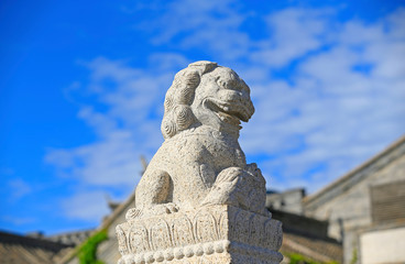 A stone lion on a stone bridge in ancient China