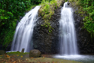 Fototapeta premium View of a cascading waterfall in Tahiti, French Polynesia