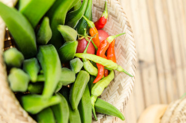 okra in bamboo bastket and chili organic food