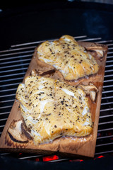 Barbecue smoked codfish with mushrooms