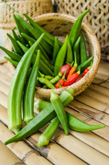 okra in bamboo bastket and chili organic food