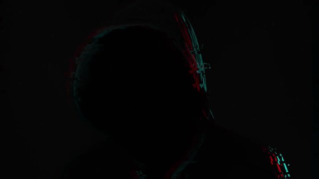 Unrecognizable faceless spooky hooded hooligan, low key with glitch effect