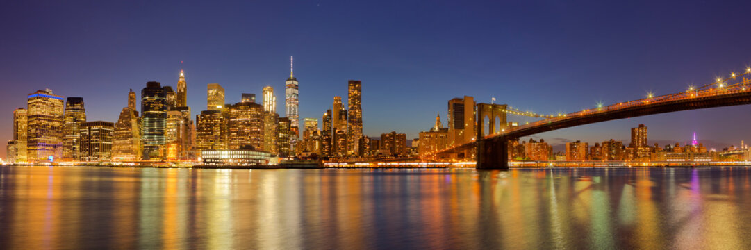 New York City skyline and Brooklyn Bridge at night