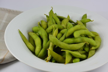 Soy beans in a white bowl