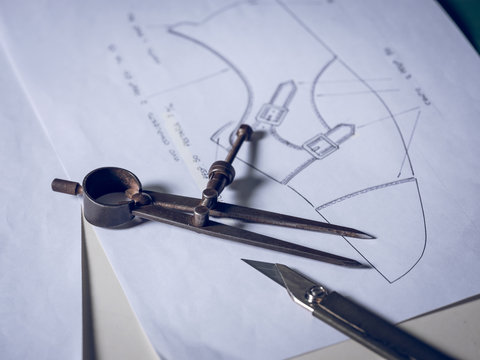 Shoe making tools lying on drafts