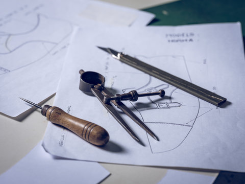 Shoe making tools lying on drafts