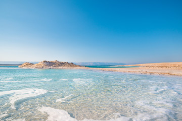 Amazing Dead Sea Beach. View of Dead Sea coastline. Salt crystals at sunset. Dead sea Israel, Jordan, Jerosolima.