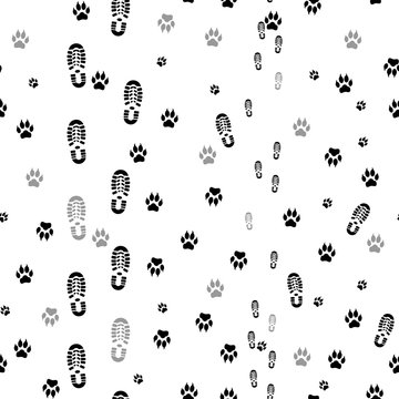 Black prints of human feet and dog paws seamless.