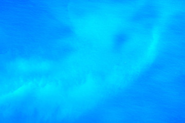 Beautiful natural abstract background. Ocean water surface. View from the plane. Tropical area.