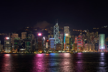 cityscape of night skyline and lighting show in hong kong
