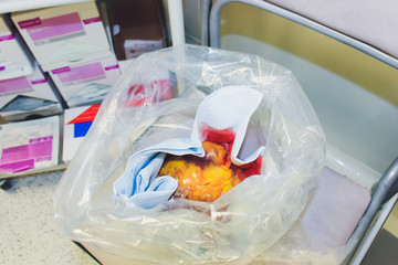 Heart organ in medical metal tray with tools on table, closeup.