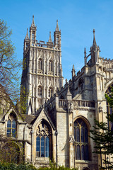 Fototapeta na wymiar Architectural detail on the tower of Gloucester cathedral in spring sunshine, Gloucestershire, UK
