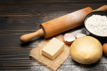 unrolled and unbaked Shortcrust pastry dough recipe on wooden background