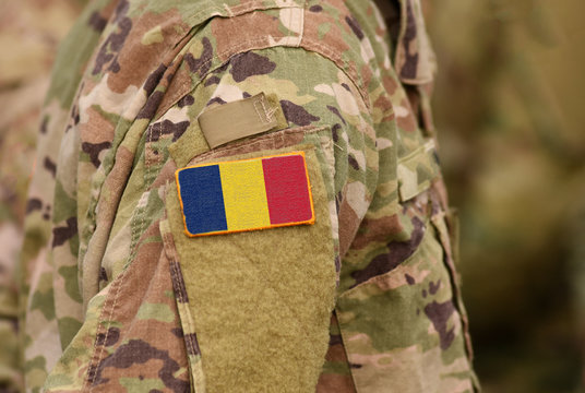 Flag of Chad on soldiers arm. Republic of Chad troops (collage)