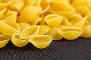 pasta on black background. Top view with copy space