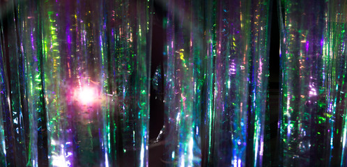 glowing neon curtain abstract background. Purple, green, blue. Christmas lights, party decoration concept. Text space