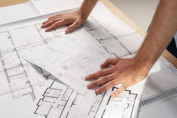 Profile side view photo of close up cropped man in formal wear stand at the table put two hands on desk