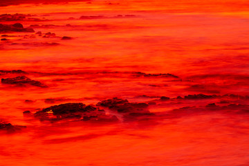 Fototapeta na wymiar Red sunset in Norway by the sea