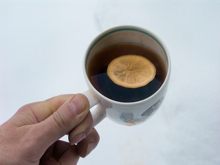 Mug of tea with lemon