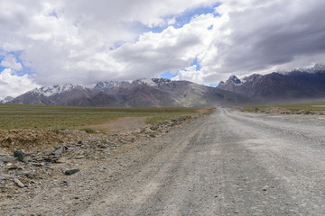 Road in Zanskar landscape view with Himalaya mountains covered with snow and blue sky in Jammu & Kashmir, India,