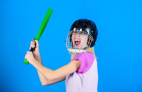 Woman enjoy play baseball game. Woman in baseball sport. Girl confident pretty blonde wear baseball helmet and hold bat on blue background. Baseball female player concept. Ready repel attack