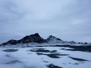 mountains and frozen lake