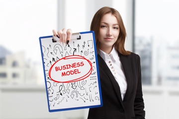 Business, technology, internet and networking concept. Young entrepreneur showing keyword: Business...