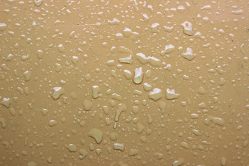 Rain droplets drops wet car beige hood