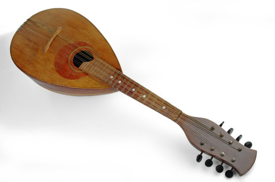 Old mandolin rotated fingerboard to the camera. Isolated on a white background.