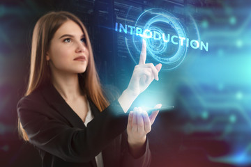 The concept of business, technology, the Internet and the network. A young entrepreneur working on a virtual screen of the future and sees the inscription: introduction