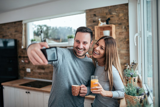 Cute Couple Taking Selfie At Home In The Morning.