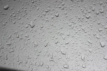 Rain droplets drops wet car grey gray black hood surface texture
