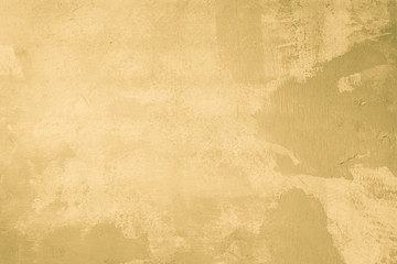 Old yellow cracked cement wall texture background