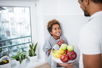 Family eating healthy snack.