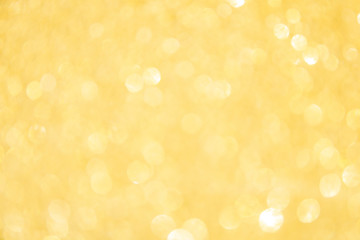 Defocused gold glitter background. Gold abstract bokeh background. Christmas abstract background