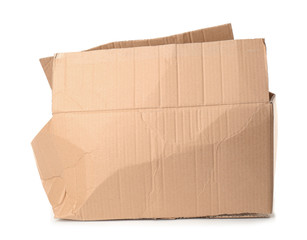 Crumpled brown cardboard box on white background. Recyclable material