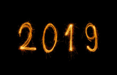 2019 Happy new year text with sparkle fireworks isolated on black