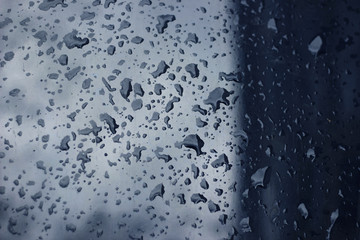 Rain droplets drops wet car blue black hood surface texture
