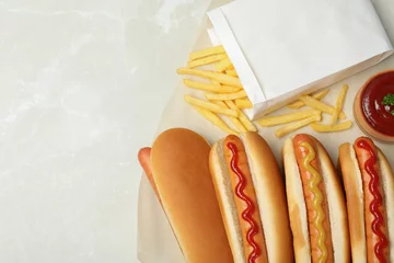 Foto op Canvas Composition with hot dogs, french fries and sauce on table, top view. Space for text © New Africa