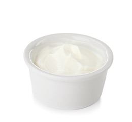 Bowl with sour cream on white background