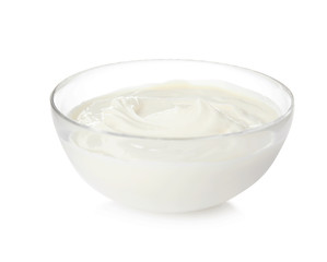 Bowl with sour cream on white background