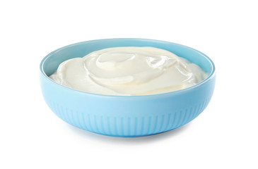 Bowl with sour cream on white background