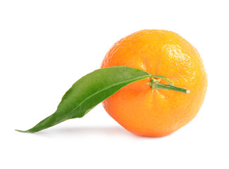 Tasty ripe tangerine with leaf on white background