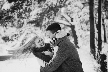 Happy young couple have fun outside in snow park