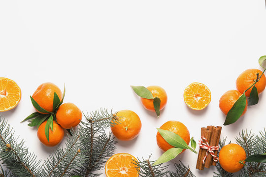 Premium Photo  Christmas fruit. orange fresh tangerines or mandarines with  green leaves in a paper bag lie.