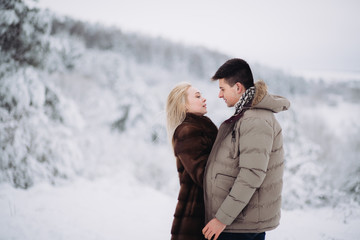 Love story in the winter forest. Valentine's Day concept