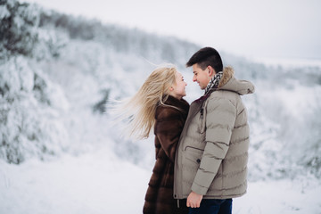 Love story in the winter forest. Valentine's Day concept